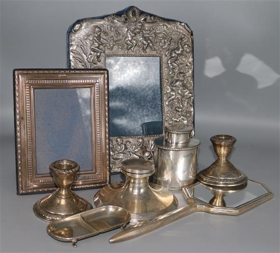 A silver photograph frame, five other silver items and two plated items.